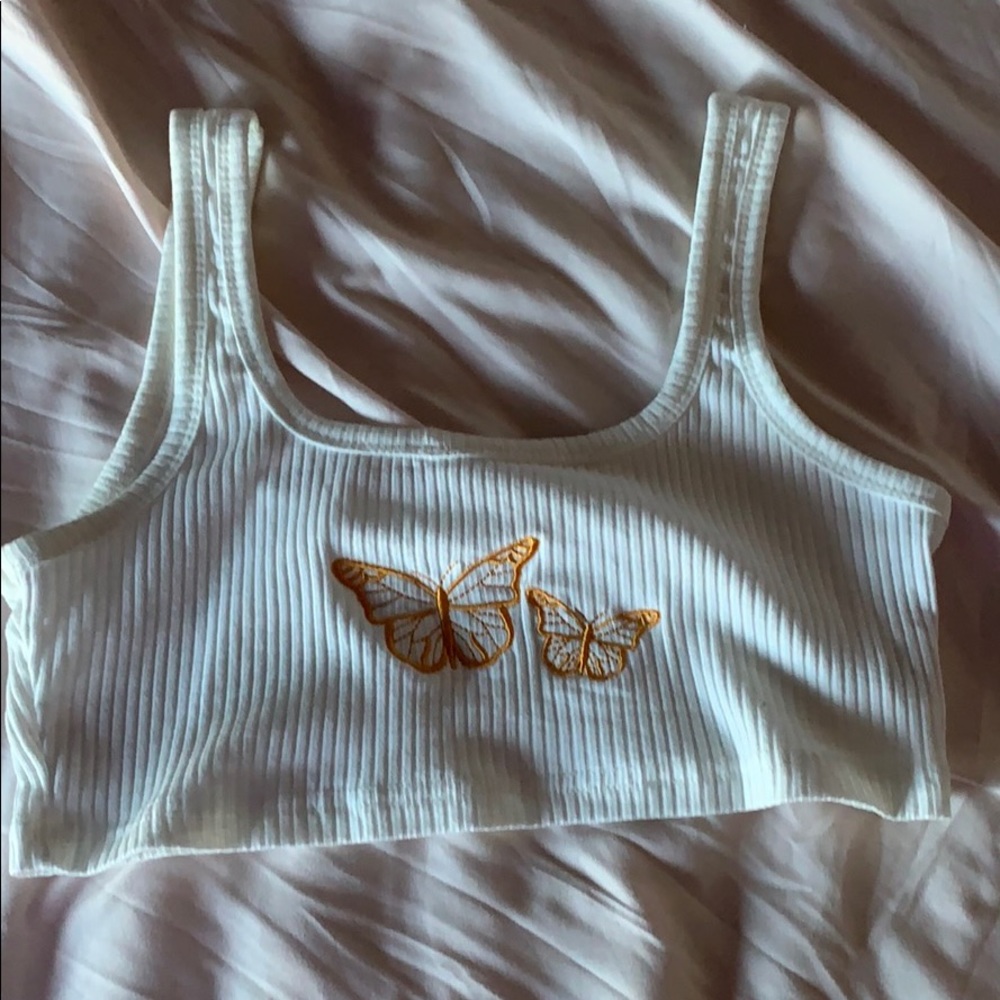 A white cropped tank top with butterflies